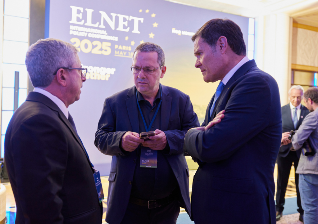 ELNET leaders and a journalist in discussion at the ELNET International Policy Conference